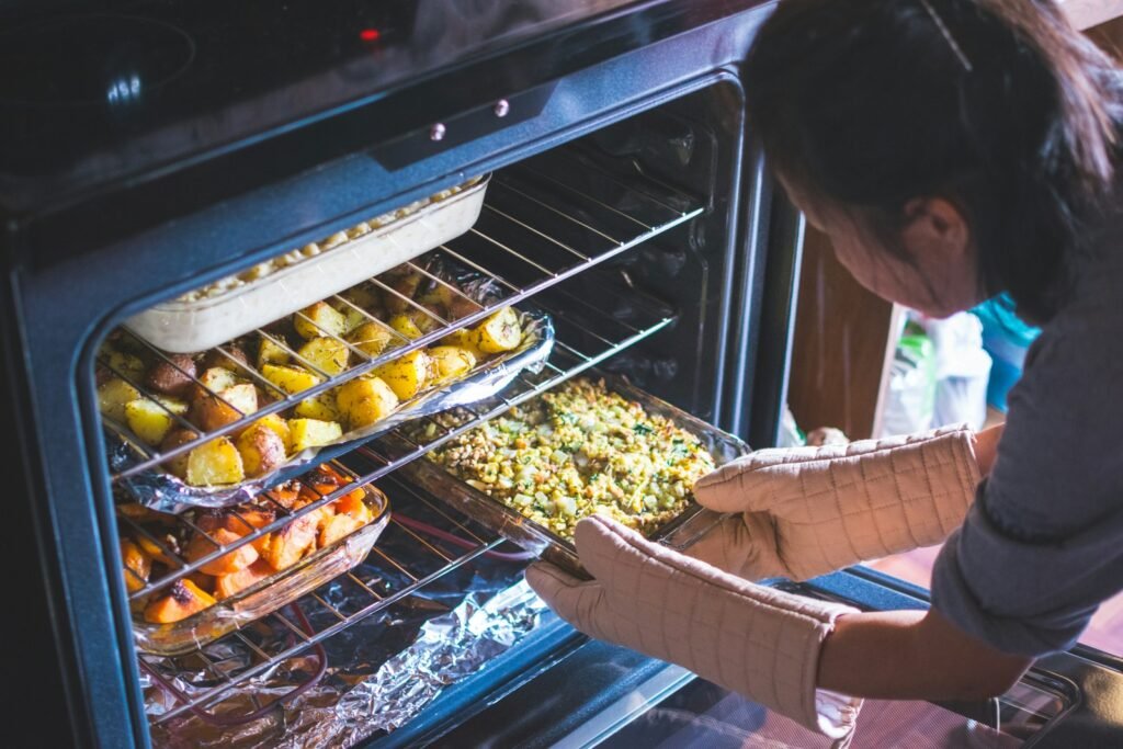 woman put food on oven