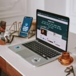 a laptop computer sitting on top of a wooden desk